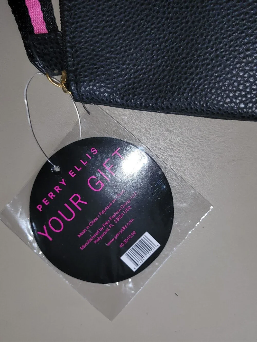 NWT - Perry Ellis Black Wristlet with Pink Trim.